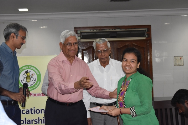 Distributing Scholarship Cheque hand on Dr. Rao Chalasani
