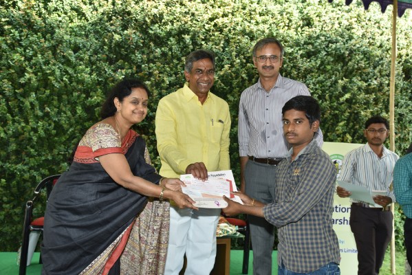 Distributed Scholarship cheque hand on Dr. Jujjavarapu Vijayalakshmi