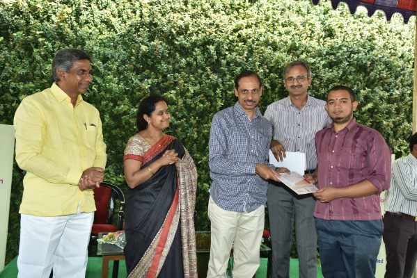 Distributed scholarship cheque on hand Exe. Director N. Srirama Krishnarao